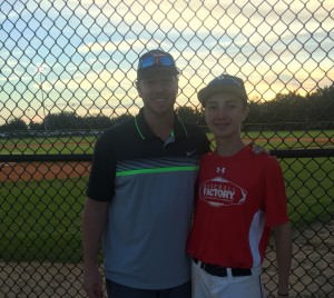 Roy with his son Braden at this year's All-America Pre-Season Rookie Tournament. 